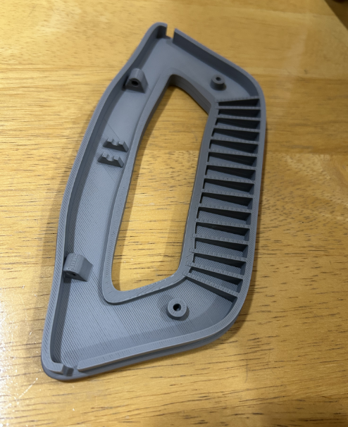 Fusion CAD development model of a washing machine door handle replacement with structural ribs, pivot supports, and latch geometry
